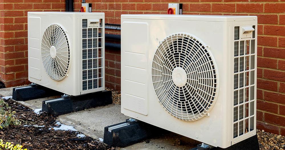 Two Heat Pump Units Outside of Home